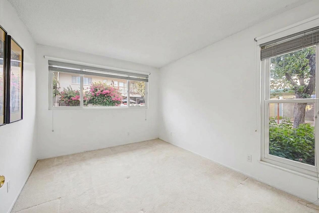 Second bedroom with garden views, unfurnished