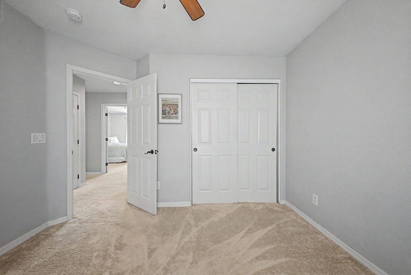 Bedroom with double closet and hallway access
