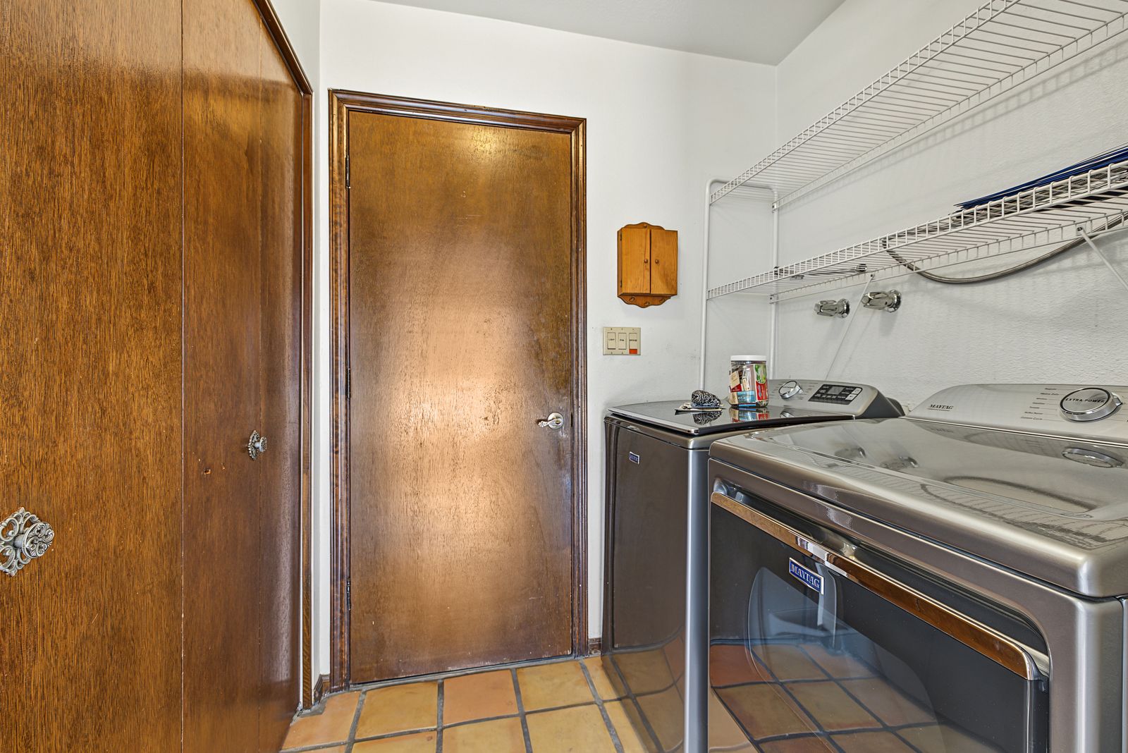 Inside laundry room with washer and dryer